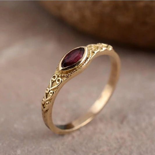 Gold vintage ring with red crystal