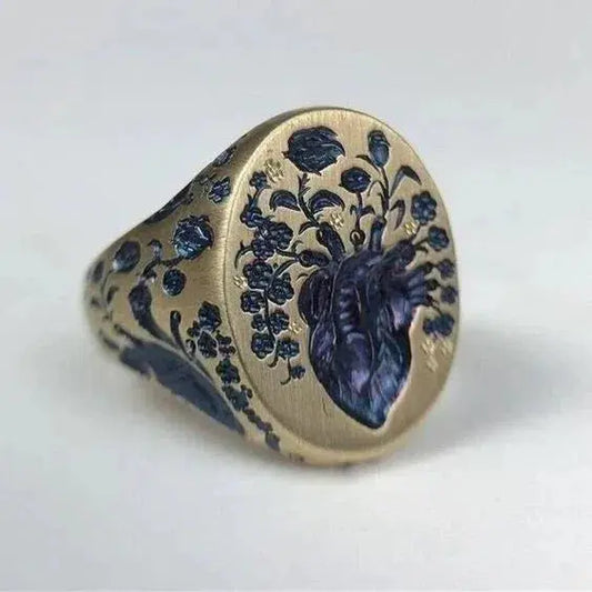 Gold ring with flower in blue color