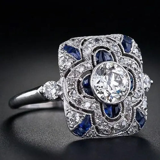 Silver ring with blue zircons